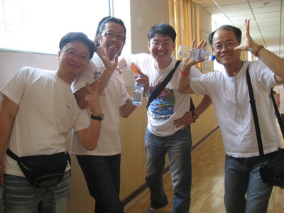 Chinese students dressed in blue jeans and white T-shirts.