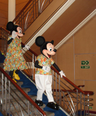 Mickey & Minnie Mouse descend the stairs