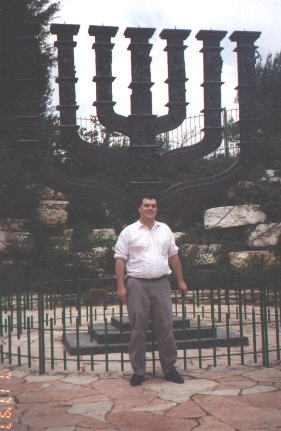 Me in front of menorah at Knesset